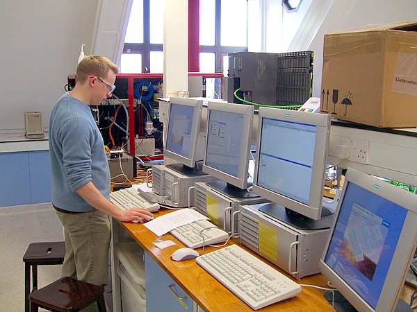 Teaching Consortium Teaching Fellow Mike Goodson checking the computers
