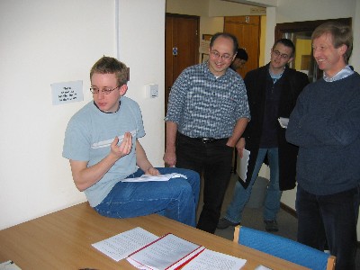 Teaching Consortium Teaching Fellow, Mike Goodson, explaining the exercise to the students. Dr. Markus Kraft (behind left) and Dr. John Dennis (behind right) are amused